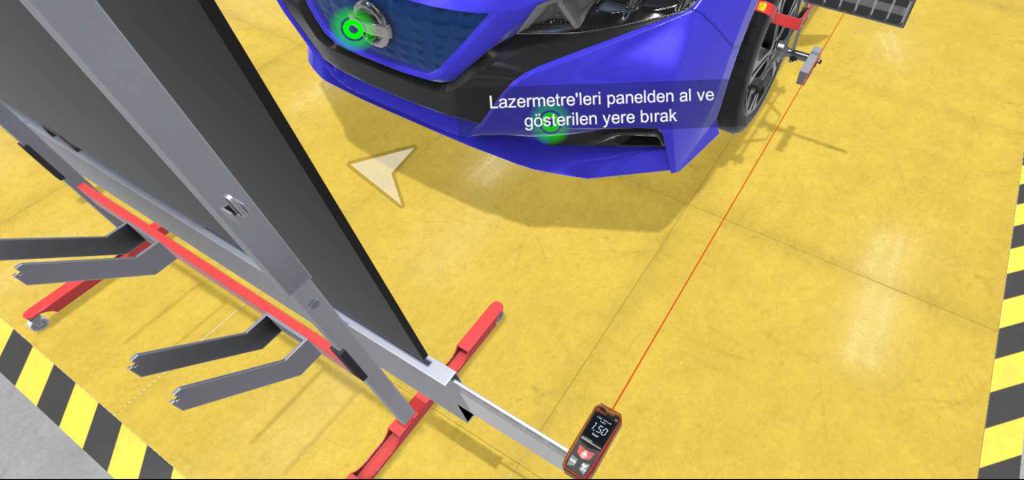 elektrikli araç bakım ve eğitimi simülatöründe ADAS ölçümü için lazer metreyle ölçüm yapılma aşaması.